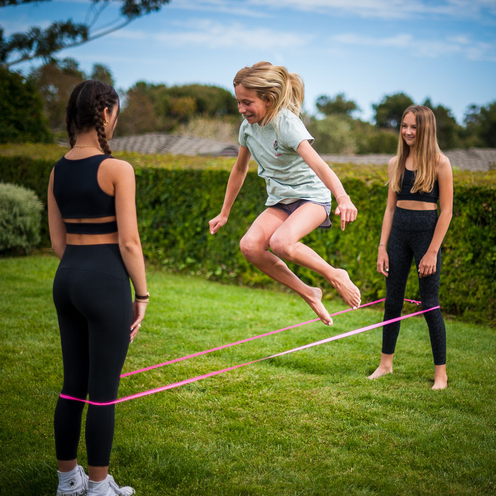 Fun is an understatement! The ATHLETICISM Jump Band is similar to the Chinese Jump Rope. It is a soft, durable, elastic band, while others are rubber. It can be used for all ages. It is best used with two friends with the band around their legs as the third person jumps. 