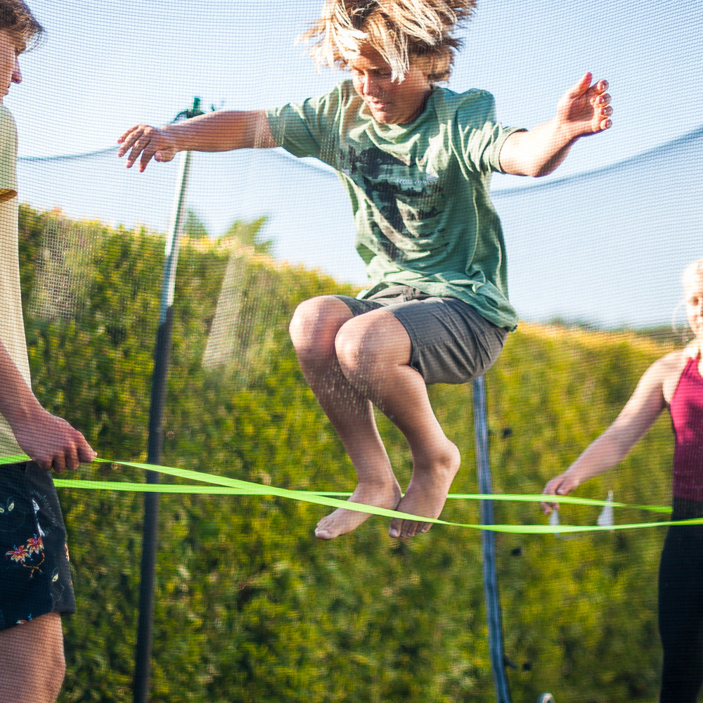 Fun is an understatement! The ATHLETICISM Jump Band is similar to the Chinese Jump Rope. It is a soft, durable, elastic band, while others are rubber. It can be used for all ages. It is best used with two friends with the band around their legs as the third person jumps. 
